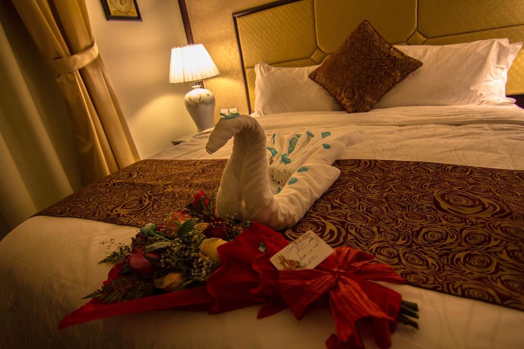 休息之夜公寓酒店 利雅德 客房 照片 A towel swan