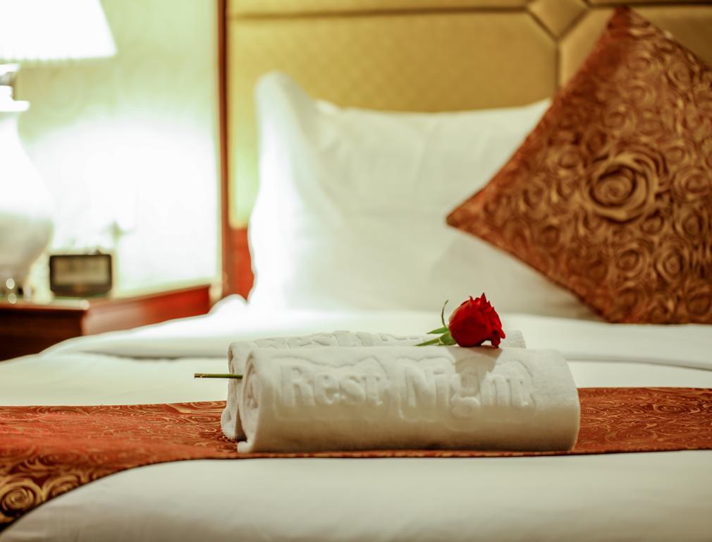 休息之夜公寓酒店 利雅德 外观 照片 A rolled towel on a bed